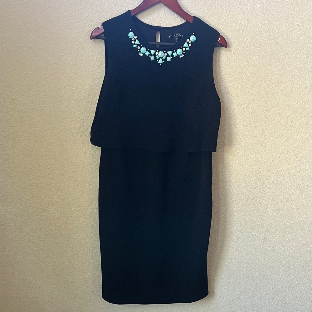 Elegant Black Sleeveless Dress with Statement Necklace